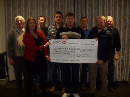 Craig Stoddart, the outgoing Chairman presents a cheque for £1125 to the Great North Air Ambulance on behalf of the club