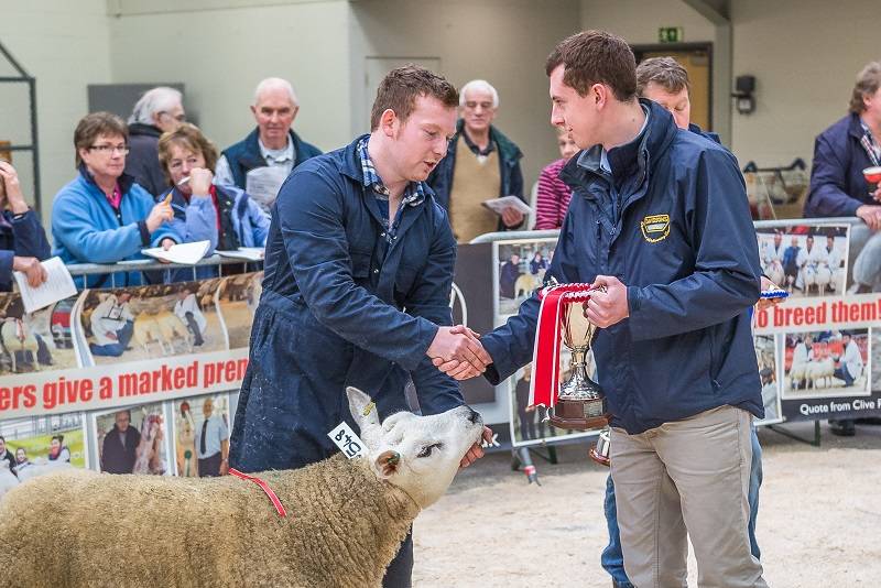 Sportsmans taking overall champion from judge James Robinson